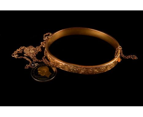 A 9ct gold bangle,  hinged with scroll design, and a 9ct gold chain and farthing pendant, 11g