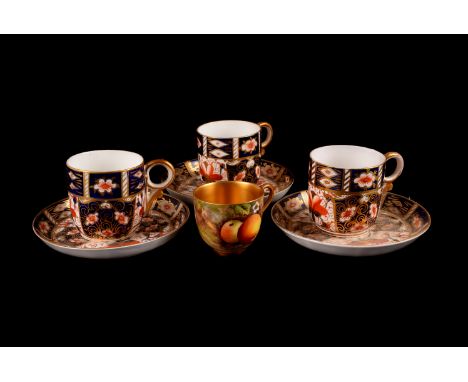 Royal Crown Derby tea ware, comprising three saucers, and four cups, plus a Royal Worcester fruit painted cup by William Hale
