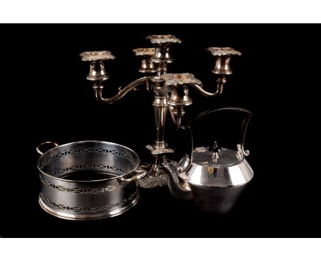 A collection of silver plated items, including a three piece tea set, kettle on stand, egg waiter, finial broken off, candela