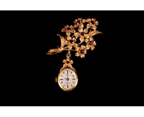 A 9ct gold and garnet Rotary lady's fob or nurse lapel watch, hallmarked to the oval case, with a single flower head set with