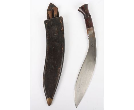 1918 Dated Kukri, with wooden grips, steel pommel cap, housed in leather covered wooden scabbard with brass lower chape. Two 