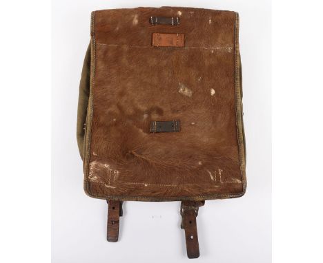 WW2 German Army Backpack, with pony fur front flap, canvas bag with black leather enforcing and metal fixing clips. Inked nam
