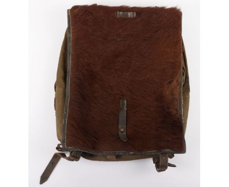WW2 German Army Backpack, with pony fur front flap, canvas bag with black leather enforcing and metal fixing clips. Inked nam