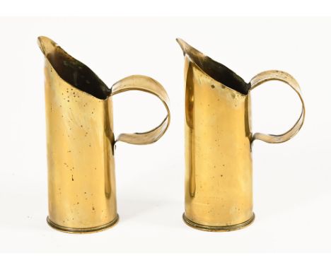 A pair of First World War Trench Art brass shell jugs, one marked with battle honours and dated 1914-15 Ypres, Kemmell, Dickb