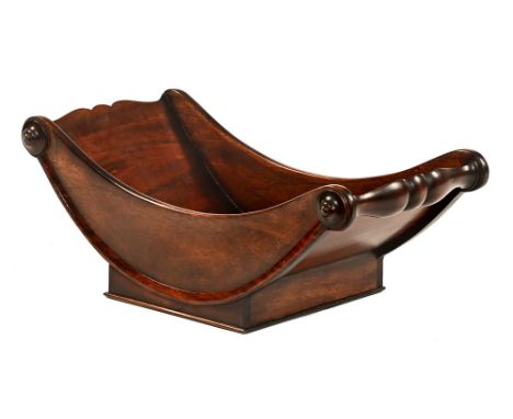 Regency mahogany bread or bun coaster.&nbsp; Length 49 cm, width 27 cm, height 19 cm (see illustration).