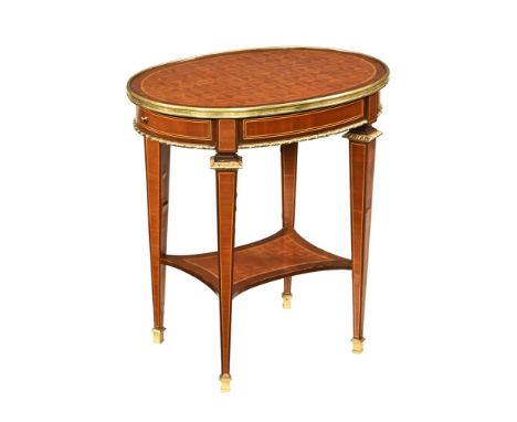 A continental style parquetry topped brass bound oval occasional table, raised on tapered legs of square section with shelf a