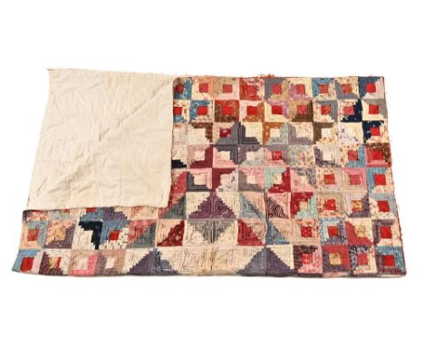 A Victorian patchwork quilt, with geometric design initialled to rear A S and dated 1887.  180 x 158 cm.