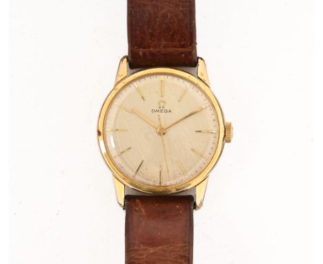 A gentleman's Omega manual wristwatch, with champagne dial and baton markers with plated case.&nbsp; Diameter 34 mm, leather 