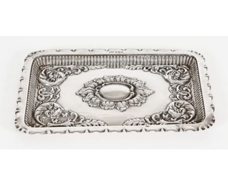 A late Victorian silver tray repousse with foliate scrolls, Birmingham mark 1900, maker Minshell & Lattimer.  Length 27.5 cm.