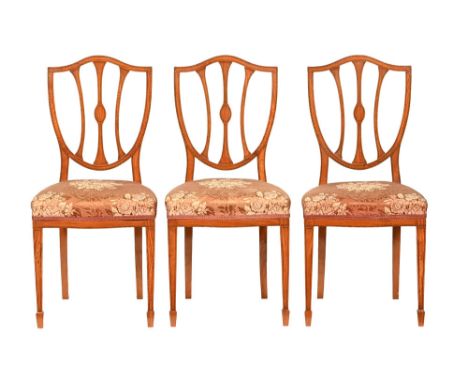 Three Edwardian inlaid satinwood Hepplewhite style bedroom chairs, with stuffover serpentine fronted seats and raised on tape