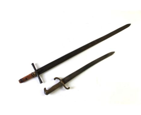 A Prussian brass handled Pioneers short sword.  Length 56.4 cm and a Sudanese sword length 98.5 cm. This bladed product is no