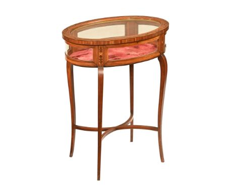 An Edwardian inlaid and penwork satinwood oval bijouterie table, raised on cabriole legs united by stretchers. Height 75 cm, 