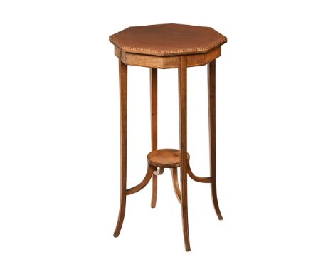 An Edwardian inlaid mahogany octagonal occasional table, with recessed frieze and raised on slightly splayed tapered legs wit