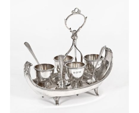 A silver egg cruet, complete with spoons, the cruet Sheffield mark 1920, spoons similarly hallmarked maker William Hutton & S