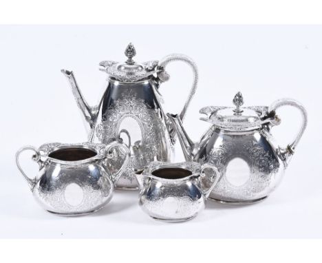 A four piece silver tea service, with foliate engraving and pierced finials with ivory spacers. Coffeepot hallmark London 188
