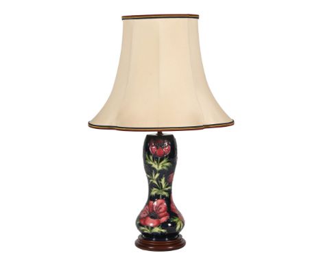 A Moorcroft big poppy patterned table lamp.&nbsp; Vase height 28 cm excluding wooden base light fitting and shade.