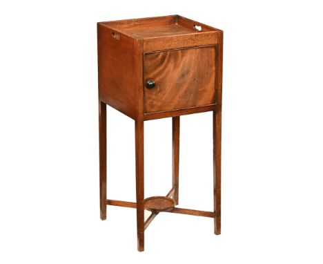 A 19th century mahogany bedside cabinet, with single door with wooden knob handle raised on tapered legs of square section un