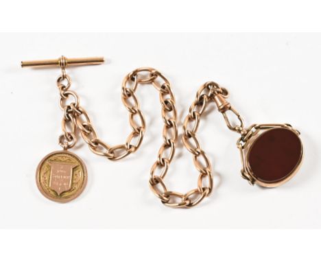 A 9 ct gold and hardstone swivel fob, and 9 ct gold medal marked "For Service 1914-1918 Hutton in the Forest AI Bell", both m