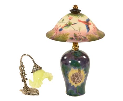 Two table lamps, one with ceramic base and bird painted glass shade, the other with Vaseline type glass shade.  Tallest 50 cm