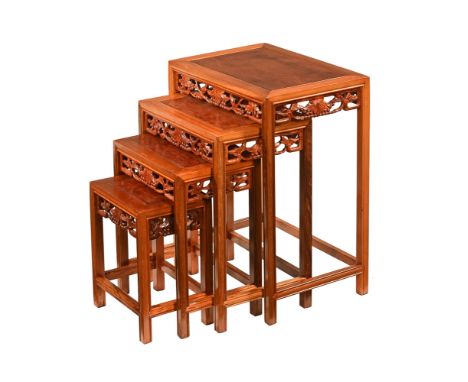 A nest of four Chinese hardwood occasional tables, largest height 66 cm, width 51 cm, depth 36 cm.The first table is generall