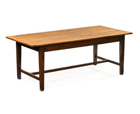 A rectangular oak refectory table, the reversible top with light or dark side, raised on square tapering legs united by a cro