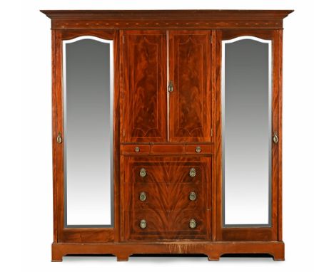 An Edwardian inlaid mahogany wardrobe by Shoolbred &amp; Co Tottenham court Road, with detachable moulded cornice above a ser