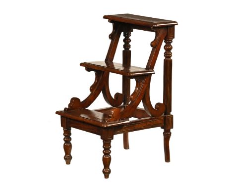 A Regency style mahogany library step, three tread raised on turned front legs.&nbsp; Height 78 cm, width 46 cm, depth 52 cm.