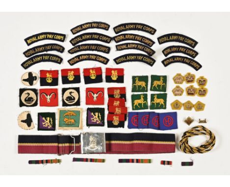 Quantity of military insignia, to include Royal Army Pay Corps cloth badges, belt etc.