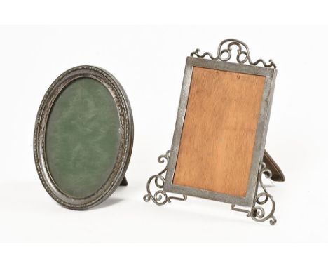 Two silver photo frames, the first oval.  Height 16 cm, width 12 cm, Birmingham 1916 and a rectangular frame, height 20 cm, w