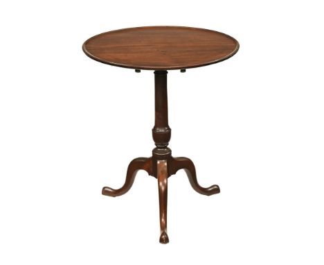 A George III mahogany tripod table, with moulded edge and snap action with turned column raised on three downswept legs termi