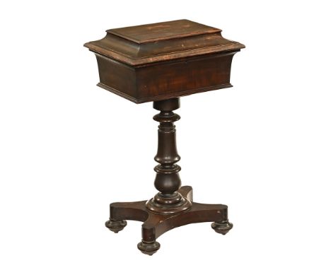 A William IV mahogany teapoy, with hinged lid to fitted interior, with turned column and quatreform base.  Height 83 cm, widt