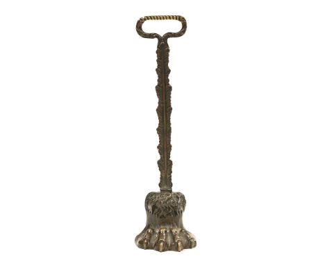 An antique bronze lead weighted hairy paw doorstop. Height 38.5 cm (see illustration).The doorstop is generally in good order