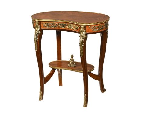 A continental kidney shaped occasional table, with starburst inlaid top with a single drawer and shelf below united by stretc