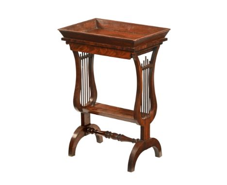 A 19th century Regency style plant table, sliding drawer and low shelf and with lyre end supports.  Height 71 cm, width 49 cm