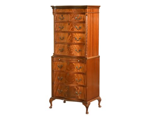 A Queen Anne style serpentine fronted chest on chest, the top half with moulded cornice above two short and three long gradua