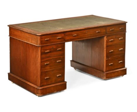 A late Victorian/early Edwardian mahogany pedestal desk, with green and gilt tooled leather writing surface, the top with one