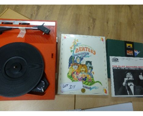 Records:  Portable record player Fidelity, Beatles Lyric Book, and two modern 45 singles.