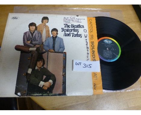Records:  Beatles – ‘Yesterday and Today’ 2nd state ‘Butchers’ album with unpeeled ‘trunk’ front cover.  US Capitol T2553 cov