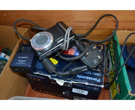 A Panasonic TZ3 compact camera with charger 