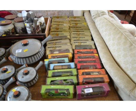 A quantity of boxed model cars