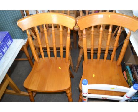 A pair of stick back dining chairs