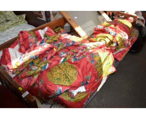 A quantity of floral patterned lined curtains with tie-backs 