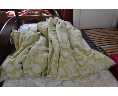 A pair of floral patterned lined curtains 