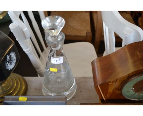 A glass decanter and stopper 