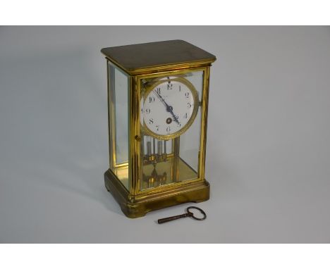 Elkington, Paris branded lacquered brass four window clock with twin mercury table pendulum, 25 cm high c/w key