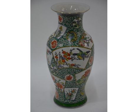 A 20th century Chinese famille-verte baluster vase with short flared neck, decorated in polychrome enamels with birds perched