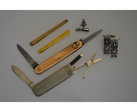 A 9ct rose gold cased double folding pocket knife, 7.8 cm long to/w an engine turned silver penknife, 6 cm long to/w two gilt