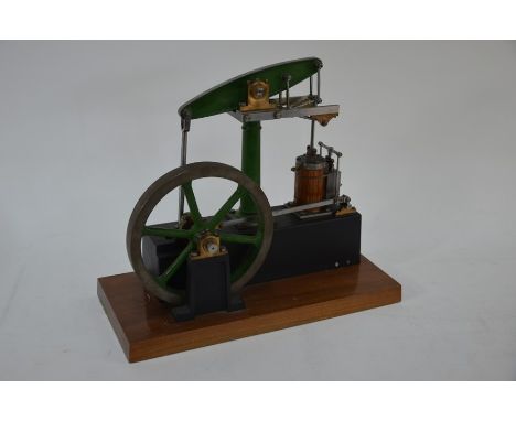 A well engineered 1 inch scale model beam engine, the 18 cm dia. wheel with dark green painted frame, on wood plinth base, 32