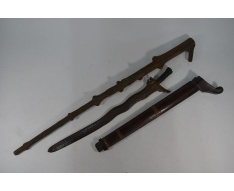 An Indonesian kris with curvy steel 56 cm blade, wire-bound grip and wooden scabbard, 65 cm overall (a/f) to/w a heavy thorn 