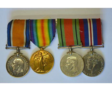 A WWI and WWII group of four medals to 2564 Pte. L.W. Gundry, Dorset Regt. 1914-18 war Medal; Victory Medal; Defence Medal; 1